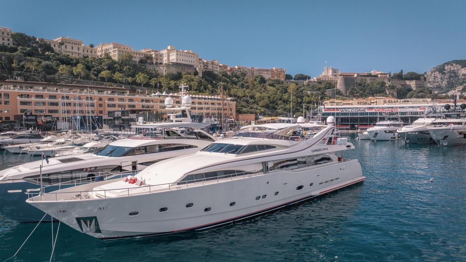 Monaco harbour with luxury yachts moored alongside the principality